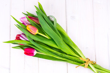 Bouquet of spring tulips on wooden table