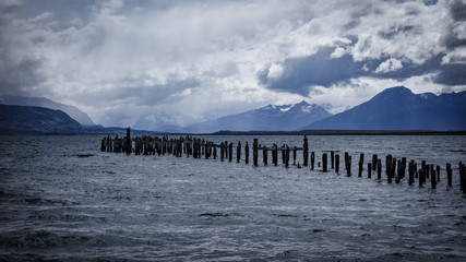 Fototapeta na wymiar The Old Pier (Muelle Historico) in Almirante Montt Gulf in Patagonia - Puerto Natales, Magallanes Region, Chile