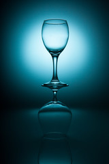 Wine and cognac glasses on a blue graduated background