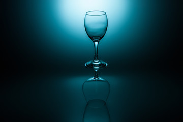 Wine and cognac glasses on a blue graduated background