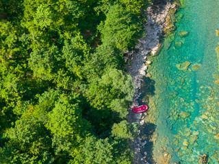Summer adventure - pontoon parked at the bank of the river, aerial view