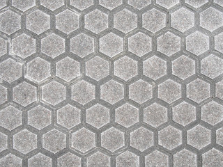 Real hexagonal gray street tile background