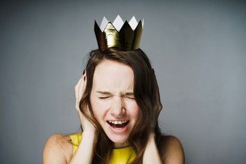 girl covered her ears with her hands, shouts