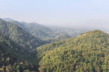 Fototapeta na wymiar high view over the hills of rainforest in Thailand 