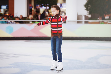 Cute teen girl learns to skate