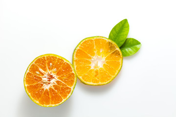Orange fruit and leaves isolated on white background.