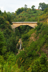 Wooden arcade bridge in Chinese alpine valley