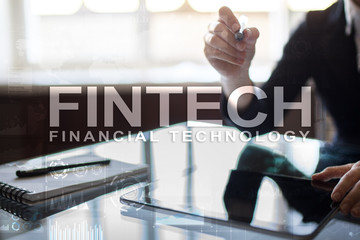 Fintech. Financial technology text on virtual screen. Business, internet and technology concept.