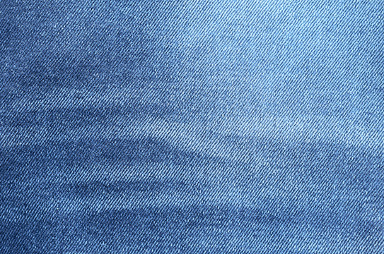Navy blue denim background closeup. Jeans texture