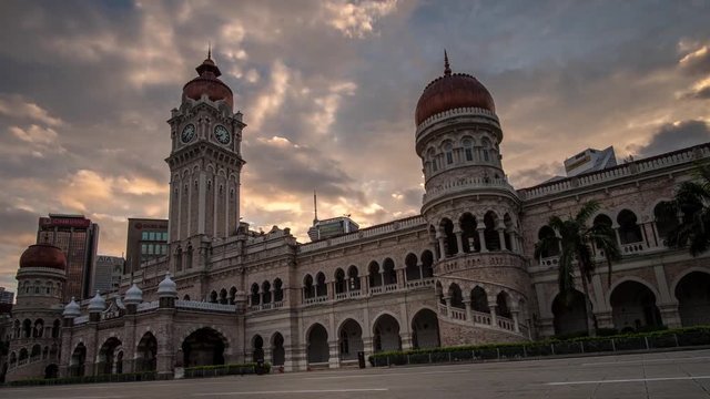 KUALA LUMPUR - MARCH 10: A beautiful panning to the left of moving cloud and sunrise view of The Sultan Abdul Samad Building on March 10, 2018 in Kuala Lumpur.