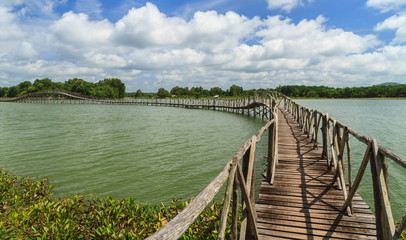 Fototapeta premium Wooden bridge across reservoir.