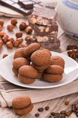 Hazelnut shortbread sandwiches filled with chocolate cream