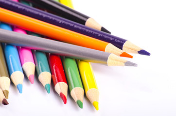 colorful color pencil stacked on white background ideal for back-to-school and education concept