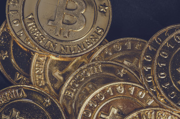Conceptual image for worldwide cryptocurrency, huge stack physical version of golden Bitcoin