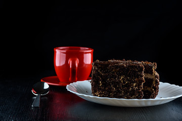 delicious coffee in a red mug on a black background