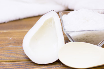 Natural herbal skin care products, top view ingredients coconut, essence oil on table concept of the best all natural face moisturizer. Facial treatment preparation background