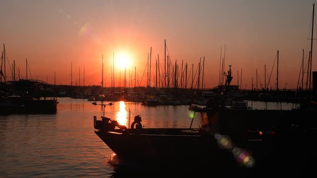 sunset over seaside harbor - Misano, Italy - September 2018