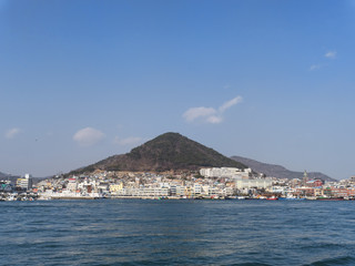 Fototapeta na wymiar Panorama from the sea to Yeosu city. South Korea. January 2018