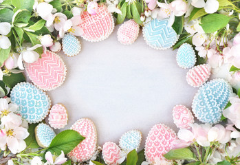 Homemade spring blossom and festive eggs cookies, Easter holiday theme sweeties decoration background, toned