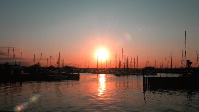sunset over seaside harbor - Misano, Italy - September 2018