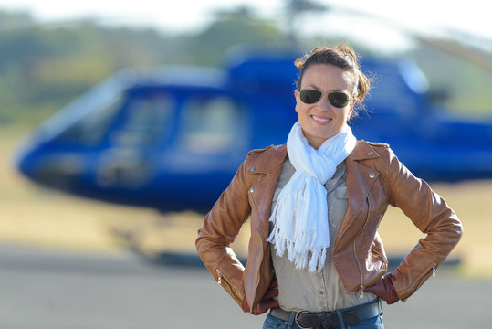 young woman by helicopter parking