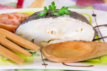 cod cooked with oil, parsley and tomato