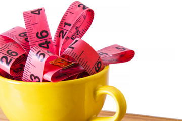 cup with metric tapes. diet and slimming concept