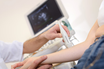 female arm getting treated by ultrasound laser equipment