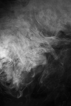 White smoke texture on a black background. Texture and abstract art