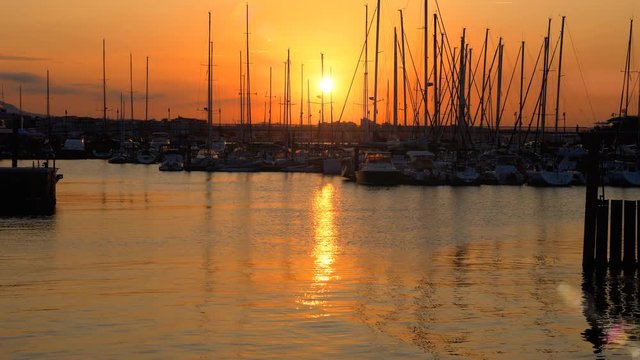 sunset over seaside harbor - Misano, Italy - September 2018