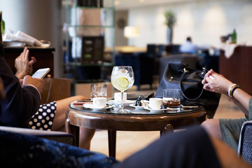 company of people resting, discussing business and drinking drinks