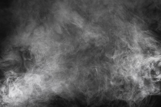 White smoke texture on a black background. Texture and abstract art