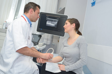 Fototapeta premium male doctor checking patients arm