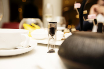 set for tea in the restaurant and hourglass