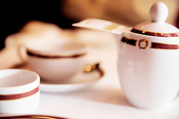 set of porcelain teapot and cups in a restaurant
