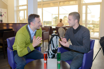 having a drink after a golf session