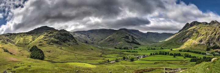 Panoramic view of the majestic mountain landscape near Coniston in the English Lake District under a dramatic sky