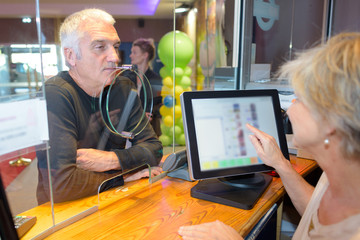 Man buying ticket at booth