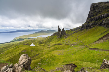 Dramatic cloudy landscape with Old Man of Storr, the most famous landmark of Isle of Skye, Scotland, Britain