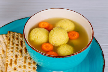 Matzah balls in a pot of soup during the Jewish holiday of Passover - Pesach.