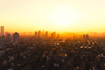 Naklejka na ściany i meble City sunset, city in golden light, in Heifei, China