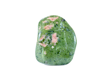 Macro shooting of natural gemstone. Raw mineral unakite, South Africa. Isolated object on a white background.