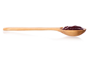 Wooden spoon of raspberry jam