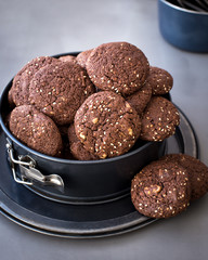 On the metal form, chocolate biscuits with sesame