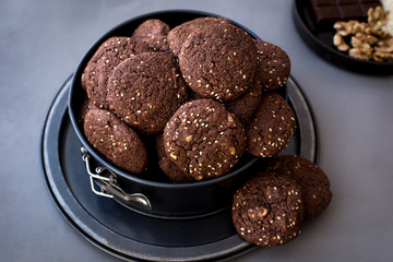 On the metal form, chocolate biscuits with sesame