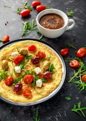 Vegetables Eggs Omelette with tomatoes, wild rocket, greek cheese, olives and coffee. Morning breakfast. healthy food