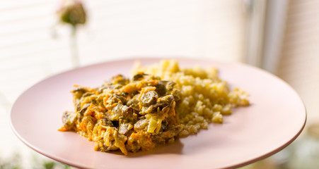 Stewed chicken hearts and porridge - bulgur.