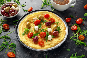 Vegetables Eggs Omelette with tomatoes, wild rocket, greek cheese, olives and coffee. Morning breakfast. healthy food