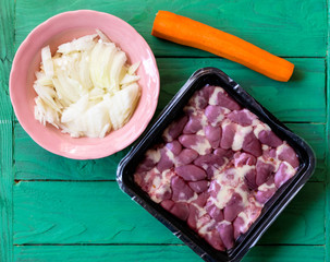 Fresh raw chicken hearts in vacuum packing.