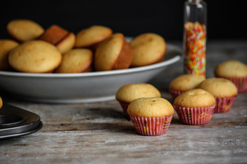 muffins (cupcakes) - fresh pastries on a wooden surface. copy space